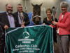 The spoils of success . . . owners John and Judy Stiven with, on either side of their pride and joy, Les and Lynette Roseveare.