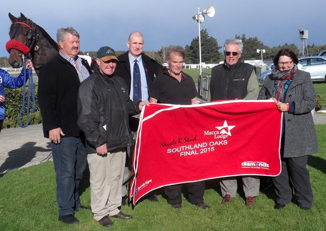 As co-sponsors of the Southland Oaks, Brent (with the cap) and Sheree McIntyre were on hand to make the presentation to the winner Smokin Bird's owner, Kevin Court.